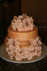 Gold and cream 50th birthday cake • <a style="font-size:0.8em;" href="http://www.flickr.com/photos/60584691@N02/5525355906/" target="_blank">View on Flickr</a>
