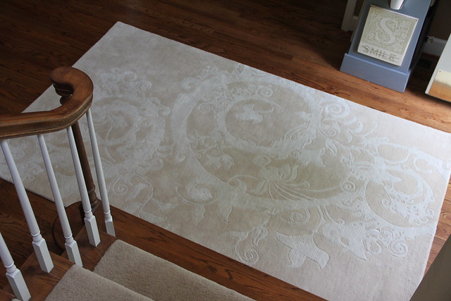 rug in two story foyer
