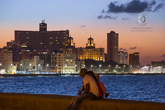People gather on the Malecon for sunset.