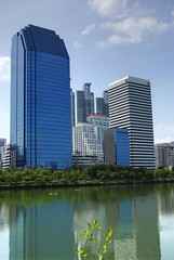 High rise buildings next to the lake in Benjakiti Park, Bangkok, Thailand