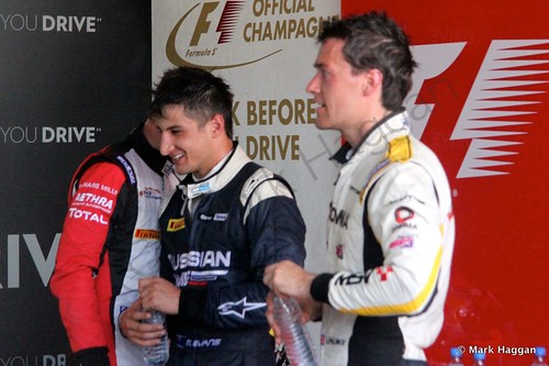 Mitch Evans, Jolyon Palmer and Soffel Vandoorne prepare for the podium after the first GP2 race at the 2014 German Grand Prix