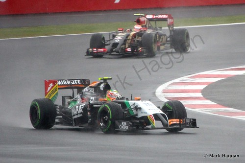 Pastor Maldonado in his Lotus chases Checo Perez in his Force India during Free Practice 3 at the 2014 British Grand Prix