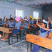 Students with self made caps, singing a joyful song