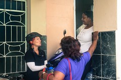 Amanda talking with complete strangers outside a store; Guantanamo, Cuba.