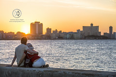 A couple enjoys the sunset in Havana.