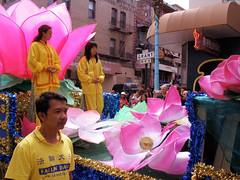 Falun Dafa parade float with lotuses • <a style="font-size:0.8em;" href="http://www.flickr.com/photos/34843984@N07/15360546520/" target="_blank">View on Flickr</a>