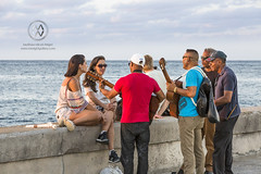 Musicians seranade tourists in Havana.
