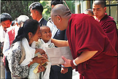 The Dalai Lama Blesses a young girl with her mother - Dharamsala, India