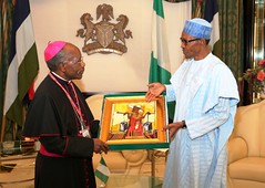PRESIDENT BUHARI RECEIVES OUTGOING HOLY SEE AMB. 2. President Muhammadu Buhari presents a parting gift to the out going Ambassador of Holy SEE, H.E Archbishop Nasujja Apostolic Nuncio at the State House in Abuja. PHOTO; SUNDAY AGHAEZE. NOV 10 2016.