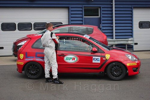 Bradley Burns gets out of his car after Race 2, Fiesta Junior Championship, Rockingham, Sept 2015