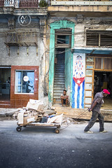 A man sits on his porch in Havana.