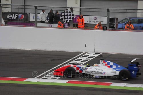 Oliver Rowland takes the chequered flag in Saturday's Formula Renault 3.5 Race at Silverstone