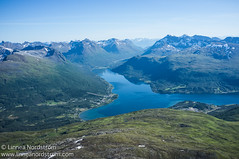 Fjord, peaks and sky