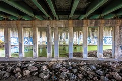 Under the overpass.