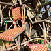 Colorful woven chairs in pile